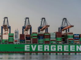 US Trade Deficit Stabilizes as Post-Tariff ‘Front-Loading’ Fades massive cargo ship at rotterdam port in sunset