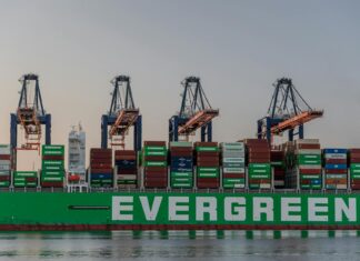 US Trade Deficit Stabilizes as Post-Tariff ‘Front-Loading’ Fades massive cargo ship at rotterdam port in sunset